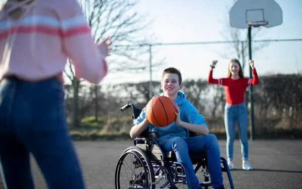 young person playing basket ball